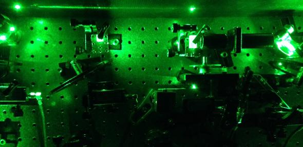 An image from an experiment in the quantum optics laboratory in Cambridge. Laser light was used to excite individual tiny, artificially constructed atoms known as quantum dots, to create “squeezed” single photons, Credit: Mete Atature