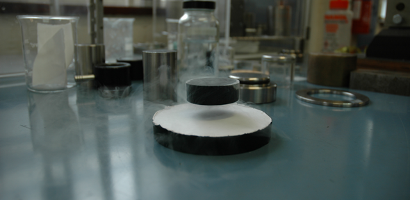 A bulk superconductor levitated by a permanent magnet, Credit: University of Cambridge