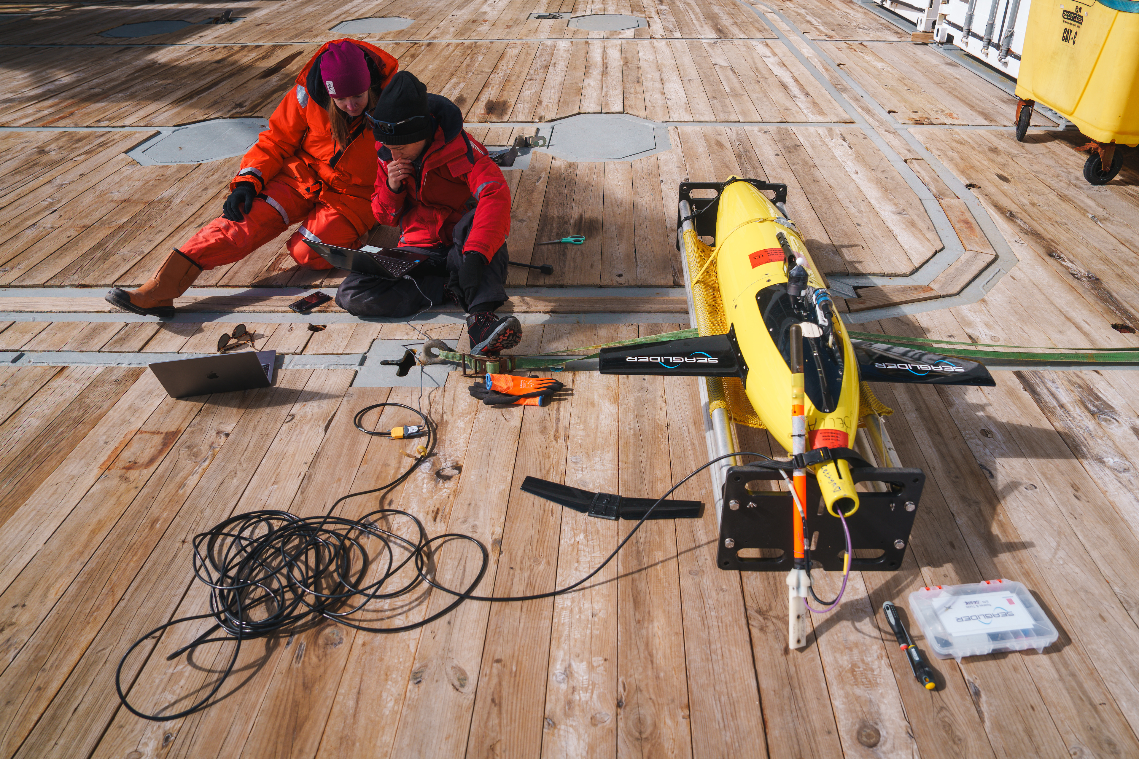 Dr Cimoli (right) and Dr Meyer (UEA, left) prepare an underwater glider for deployment.