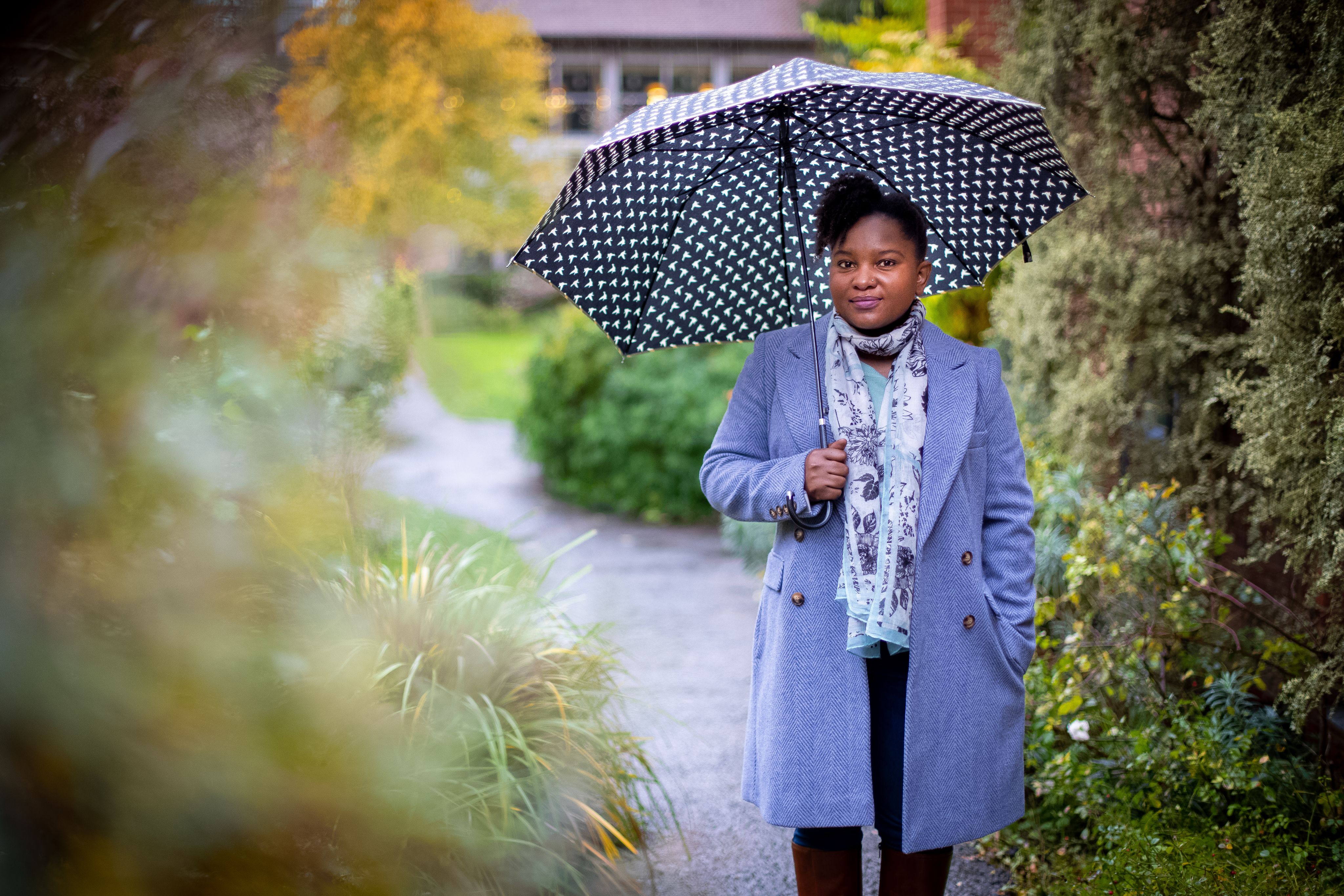 Rumbidzai Dube in the gardens at Lucy Cavendish College