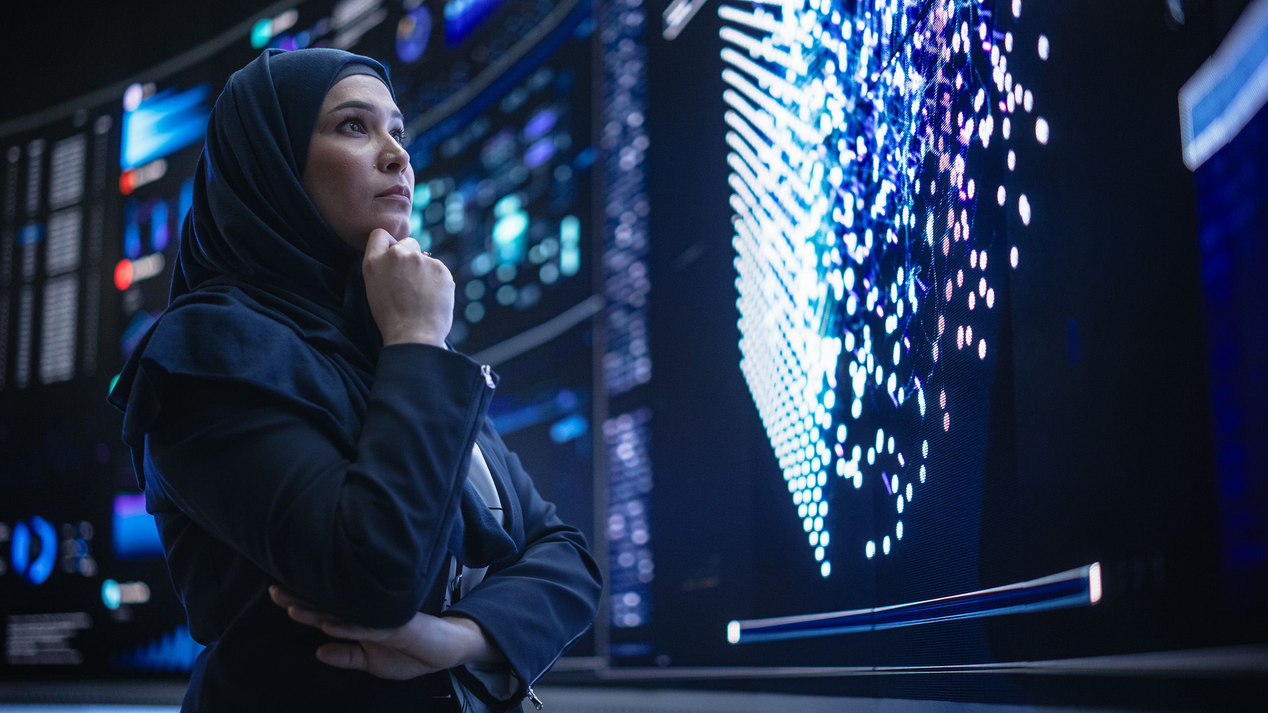Data scientist looking at screen