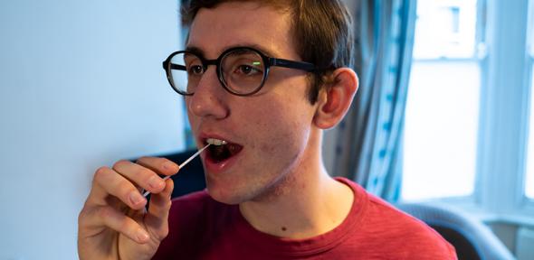 Student talking a COVID-19 test