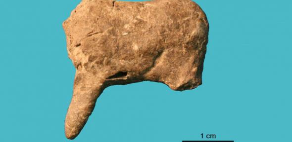 Leg and torso from the model of a four-legged animal, possibly a deer or horse. This is one of 36 ceramic items recovered from Vela Spila, Croatia.