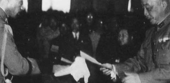 General Chen Yi of China accepts the surrender of Andō Rikichi, the Japanese Governor-General of Taiwan. The collapse of Japanese Imperial rule in the area marked the beginning of a new era for both countries.