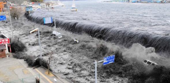 A wave approaches Miyako City from the Heigawa estuary in Iwate Prefecture