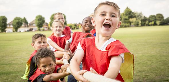 Group of children playing tug of war