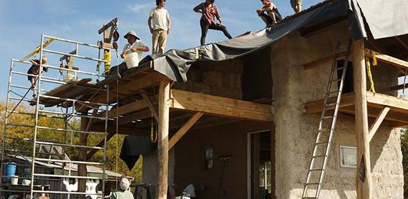 People installing a living roof in 2012