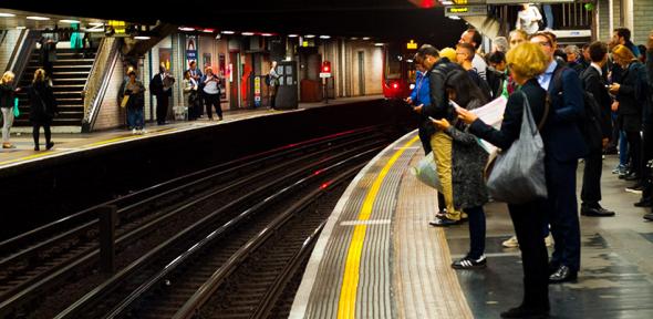 Passengers at a London Underground station