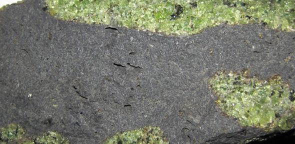 Chunks of exotic green rocks from the mantle erupted from the San Carlos Volcanic Field, Arizona