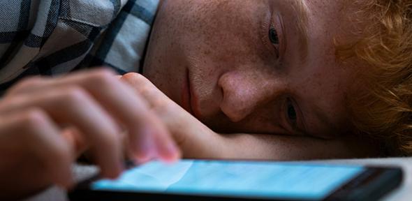 Teenage boy with smart phone , Credit: D-Keine via Getty Teenage boy with smart phone
