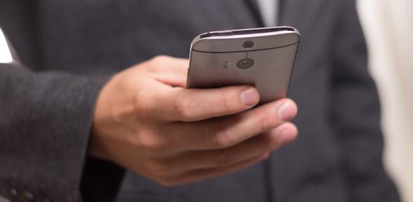 Man in suit on mobile phone