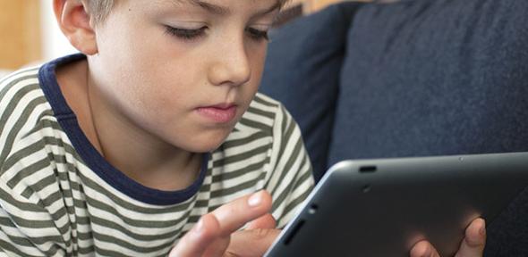 Child playing on tablet 