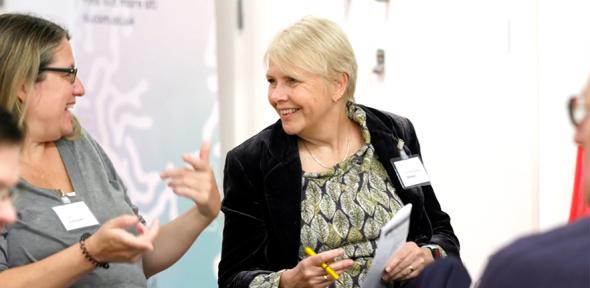 Two people talking at a public dialogue workshop