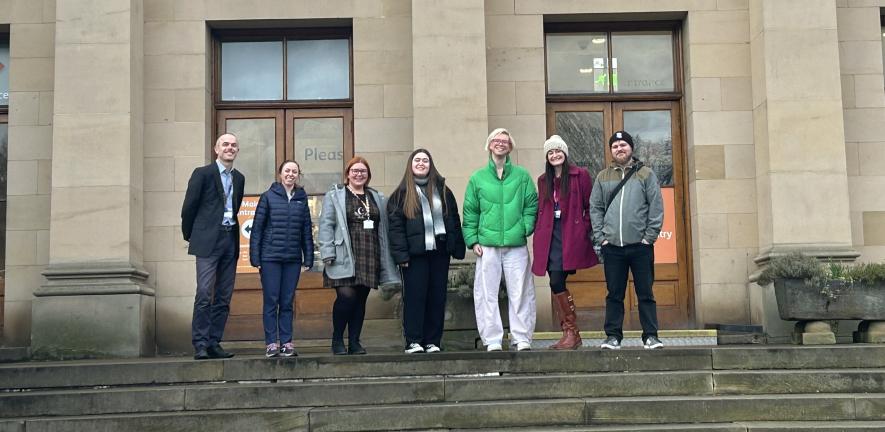Outreach officers on steps of museum