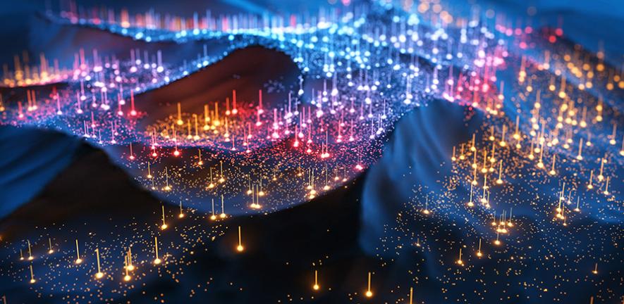 Digital generated image of multi coloured glowing data over landscape.