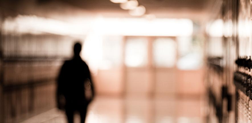 Boy in school corridor