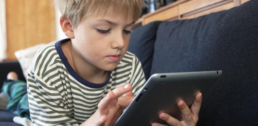Child playing on tablet 