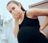 Pregnant woman about to be sick