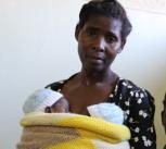 Suffering from pre-eclampsia, this young mother had to undergo a Caesarean to deliver her twin boys, seen here in the arms of her mother (Malawi)