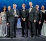 Collecting the Boeing Innovation Award on behalf of the University of Cambridge: Professor Bill O'Neill (holding the Award), Dr John Durrell (centre), and Philip Guildford (centre, right).