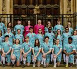 A group of student footballers wearing University of Cambridge kit