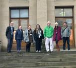 Outreach officers on steps of museum