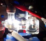 Experimental two-electrode setup showing the photoelectrochemical cell illuminated with simulated solar light