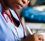 Sierra Leonean Junior Doctor, Marina Kamara, follows up on a suspected kidney infection.