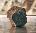 An iron meteorite from the core of a melted planetesimal (left) and a chondrite meteorite, derived from a ‘primitive’, unmelted planetesimal (right).