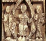 Left: Upper jaw bones of a walrus, with tusks removed. Right: an elaborately-carved ecclesiastical walrus ivory plaque.