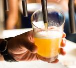 Man pouring a pint of beer