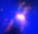 Composite image showing how powerful radio jets from the supermassive black hole inflated huge bubbles in the hot, ionized, gas surrounding the galaxy. Credit: ALMA