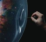 A pin being pushed into a bubble, in which there is an image of the Universe