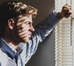 Man looking out of window