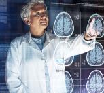 Futuristic image of a doctor looking at brain scans