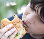Boy eating a burger