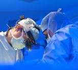 Surgeons performing heart surgery
