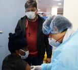 Health care workers administering covid-19 vaccination in New Delhi
