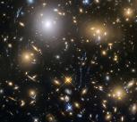 Observations by the NASA/ESA Hubble Space Telescope have taken advantage of gravitational lensing to reveal the largest sample of the faintest and earliest known galaxies in the universe. 