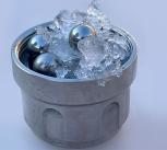 Part of the set-up for creating medium-density amorphous ice: ordinary ice and steel balls in a jar (not amorphous ice)