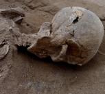 Left: Skull of a man found lying prone in the lagoons sediments. The skull has multiple lesions consistent with wounds from a blunt implement. Right: The skull in situ. 