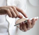 Person holding white Android phone