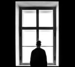 Man standing in front of window