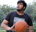 Overweight man playing basketball