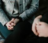 Close up of hands of two people talking