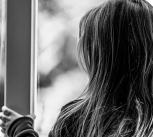 Child looking out of a window
