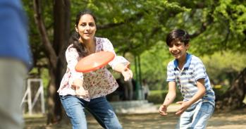 Family playing frisbee