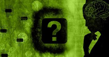 Silhouette of a woman facing a question mark and microchips
