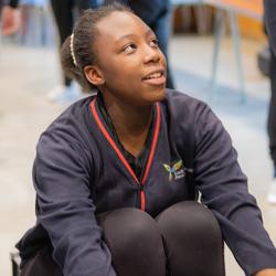 Student using an indoor rowing machine