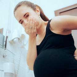 Pregnant woman about to be sick